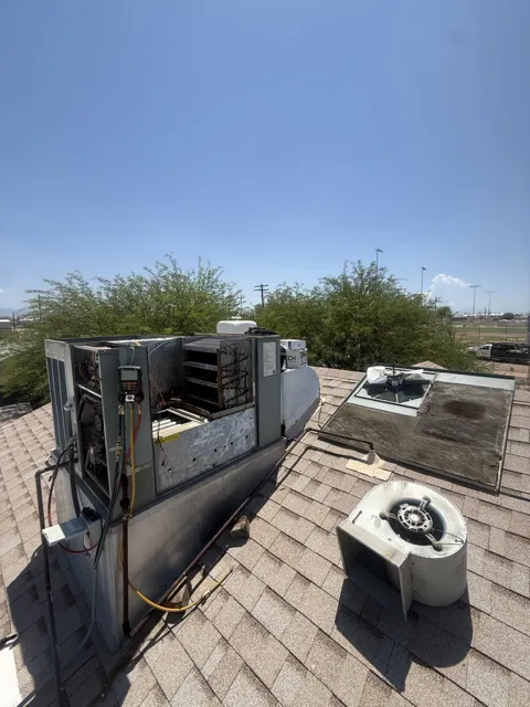 Rooftop HVAC unit with an open service compartment