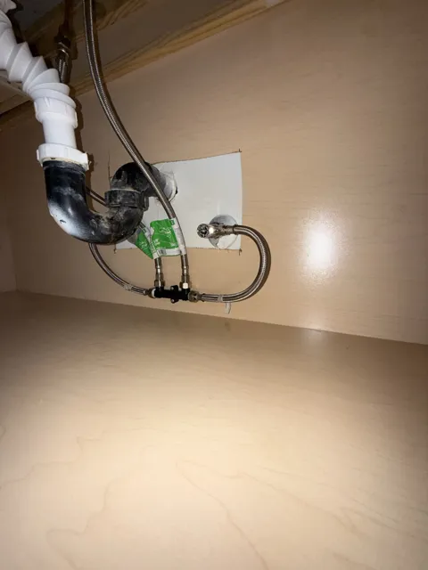 Under-sink drain piping and water supply connections